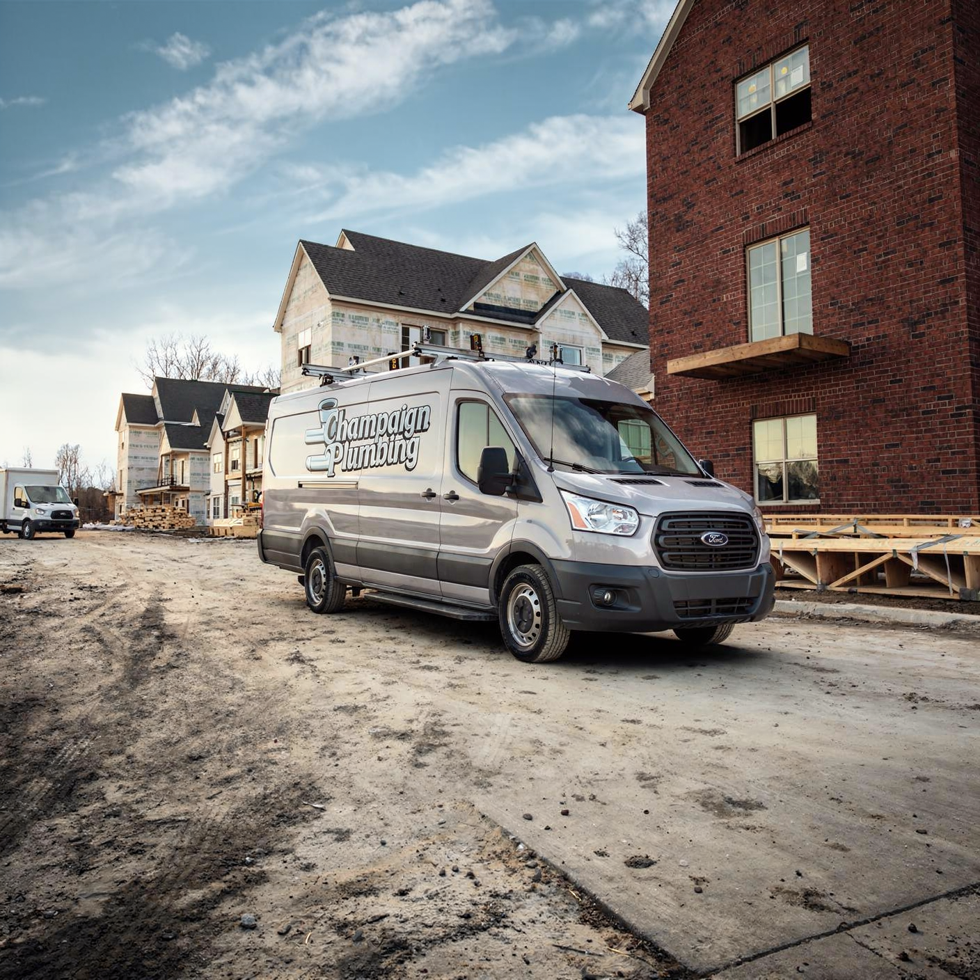Champaign Plumbing Company Work Van on Jobsite